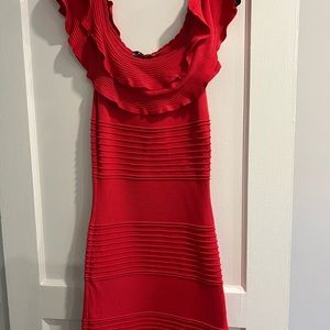 Red ruffle off the shoulder cocktail dress.
